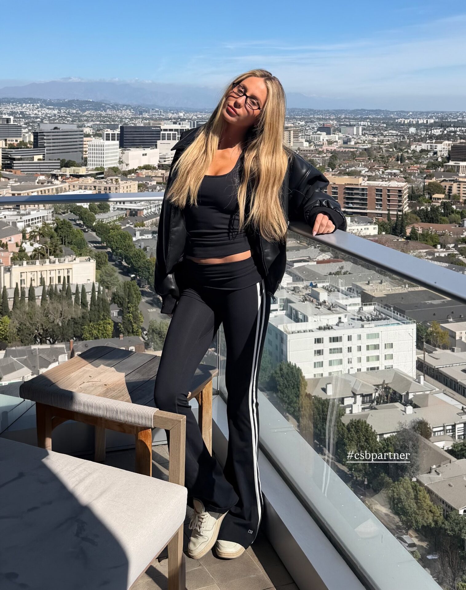 Alix Earle Black Bomber Jacket + Black White Stripe Flared Leggings