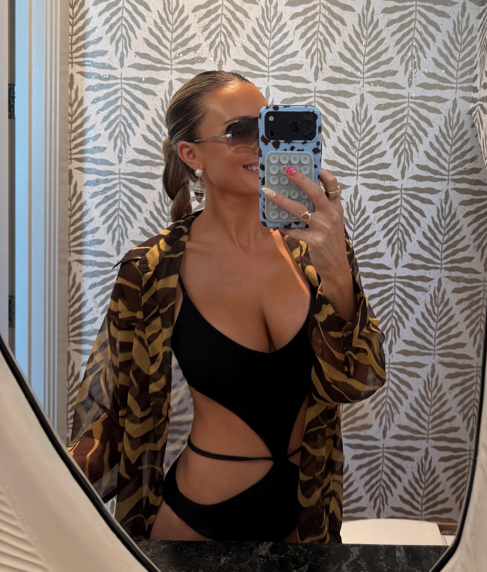 Brittany Aldean Black Cut Out Swimsuit + Tan Zebra Sheer Shirt