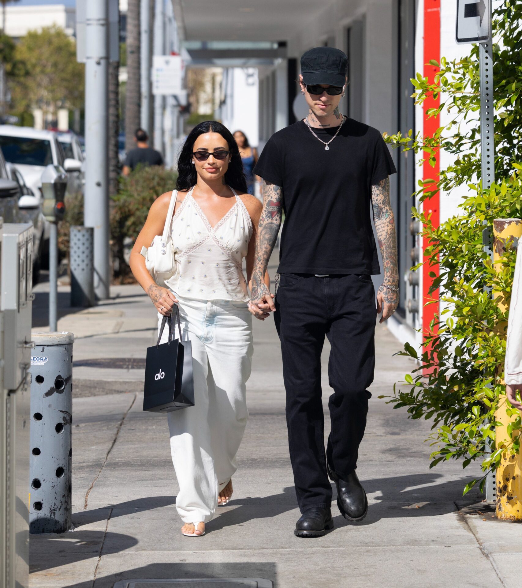 Demi Lovato Ivory Rose Print Top + White Leather Bag
